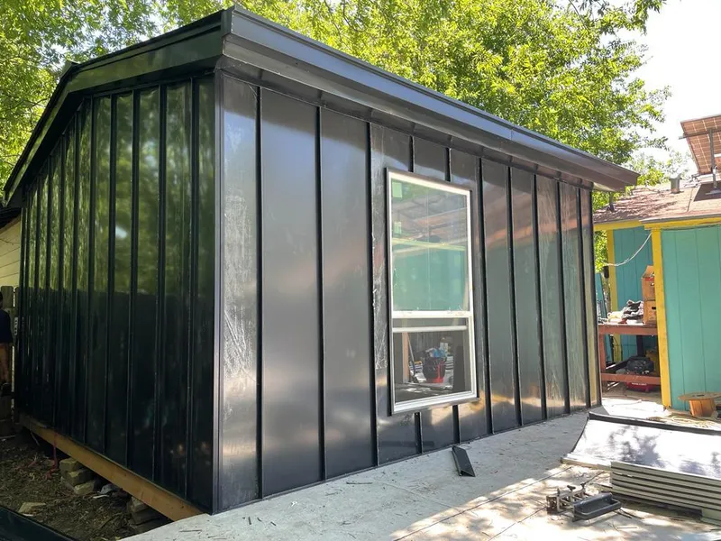 Black standing seam metal wall panels for Roof Inspection in Sugar Hill